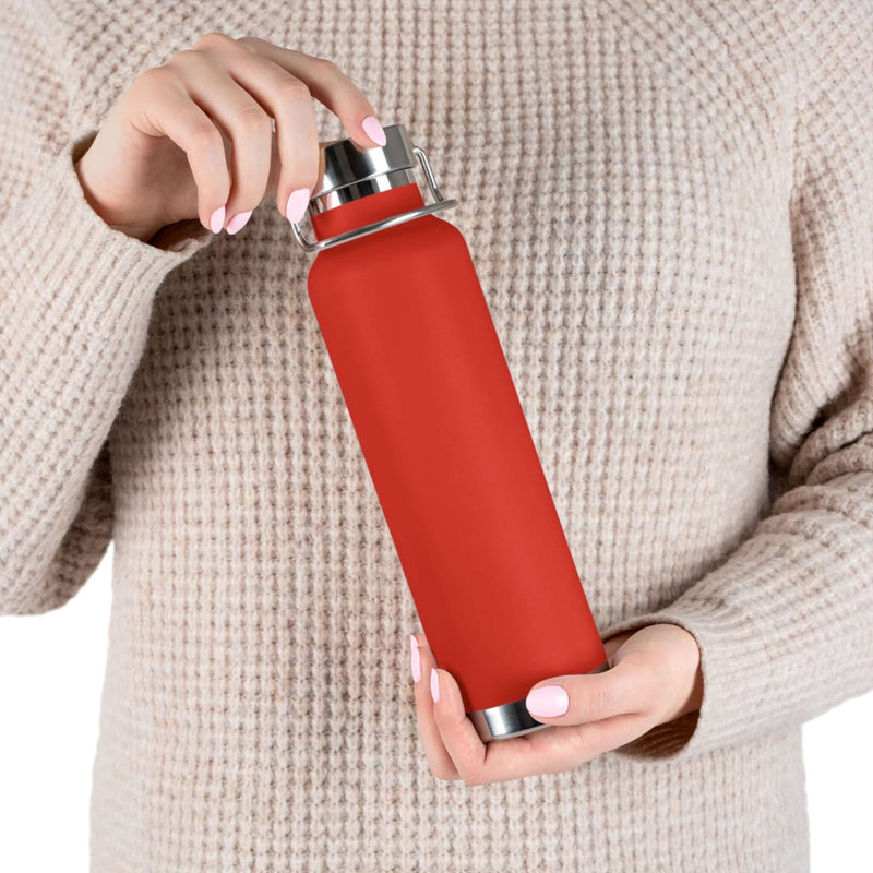body view of person holding Copper Vacuum Insulated Bottle, 22oz